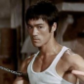 Bruce Lee with his nunchaku sticks